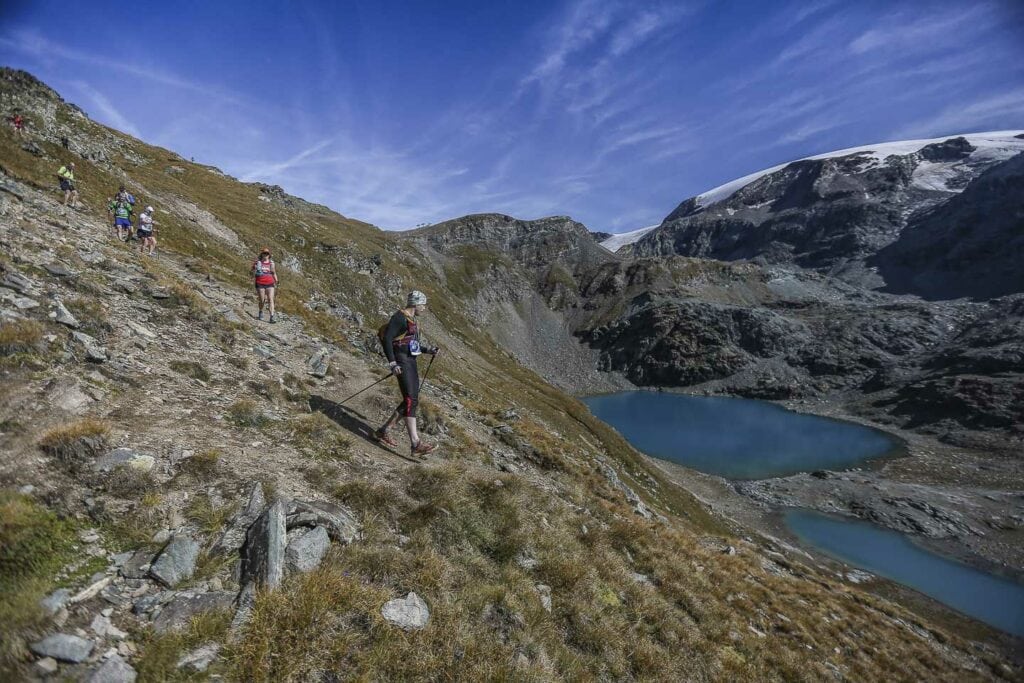 runing past turquoise lakes to gressoney